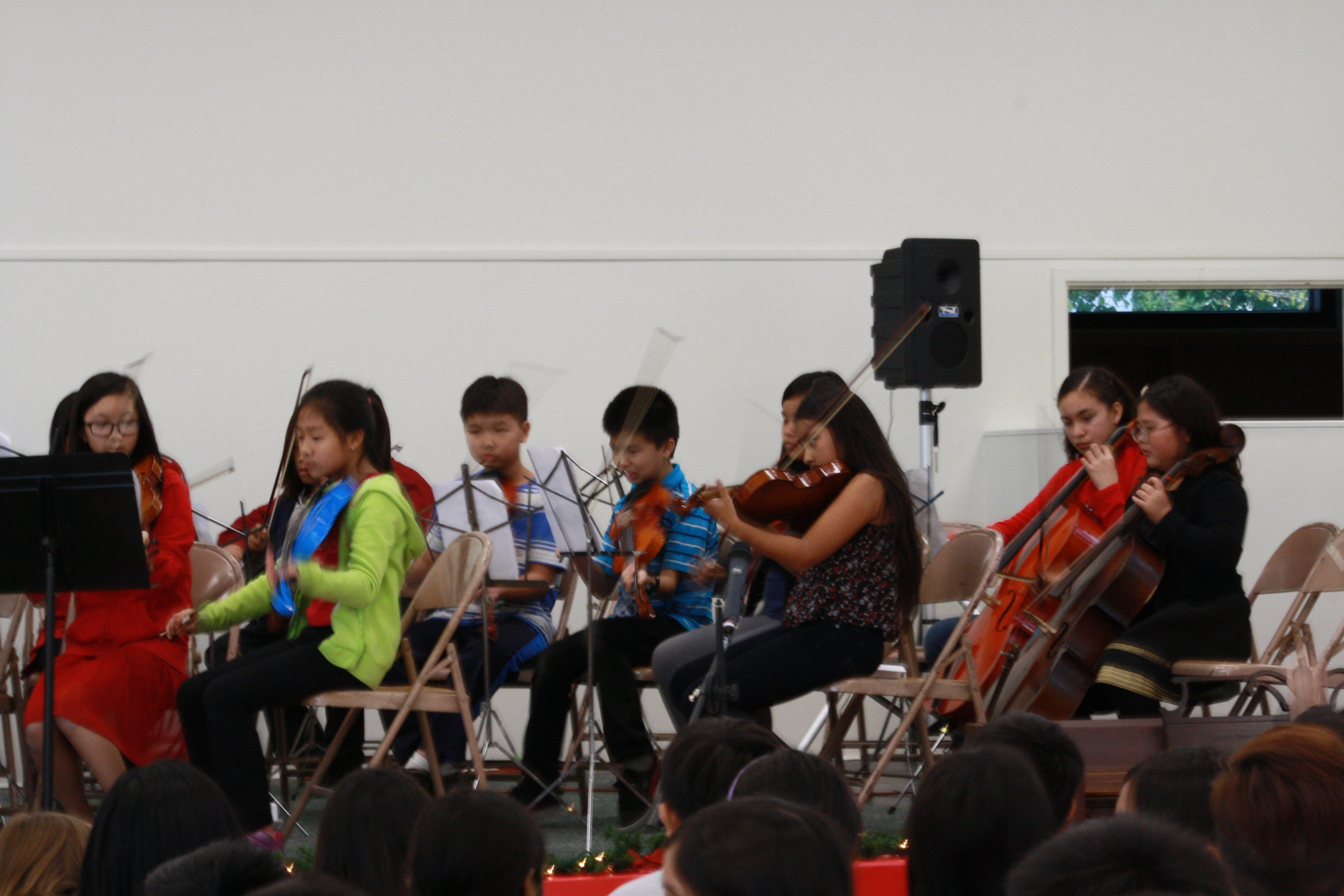 Our talented students enjoy participating in the school's orchestra!