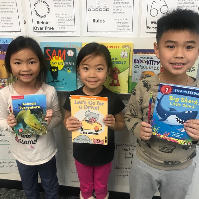 First graders get to read a book with the principal every Friday!